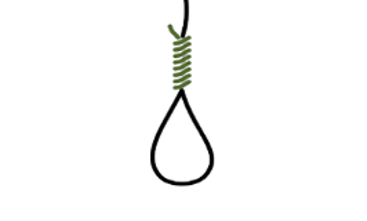 Ein schwarzes hängendes Seil mit einem grünen Galgenknoten wie man das aus Western Filmen kennt